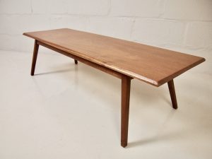 Solid teak plank coffee table on splayed legs